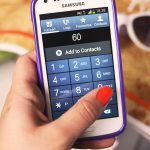 hand holding a smartphone to make a payment