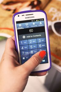 hand holding a smartphone to make a payment