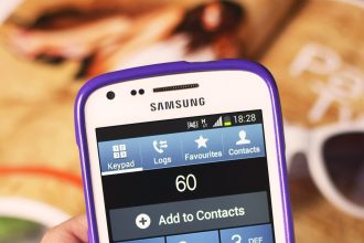 hand holding a smartphone to make a payment