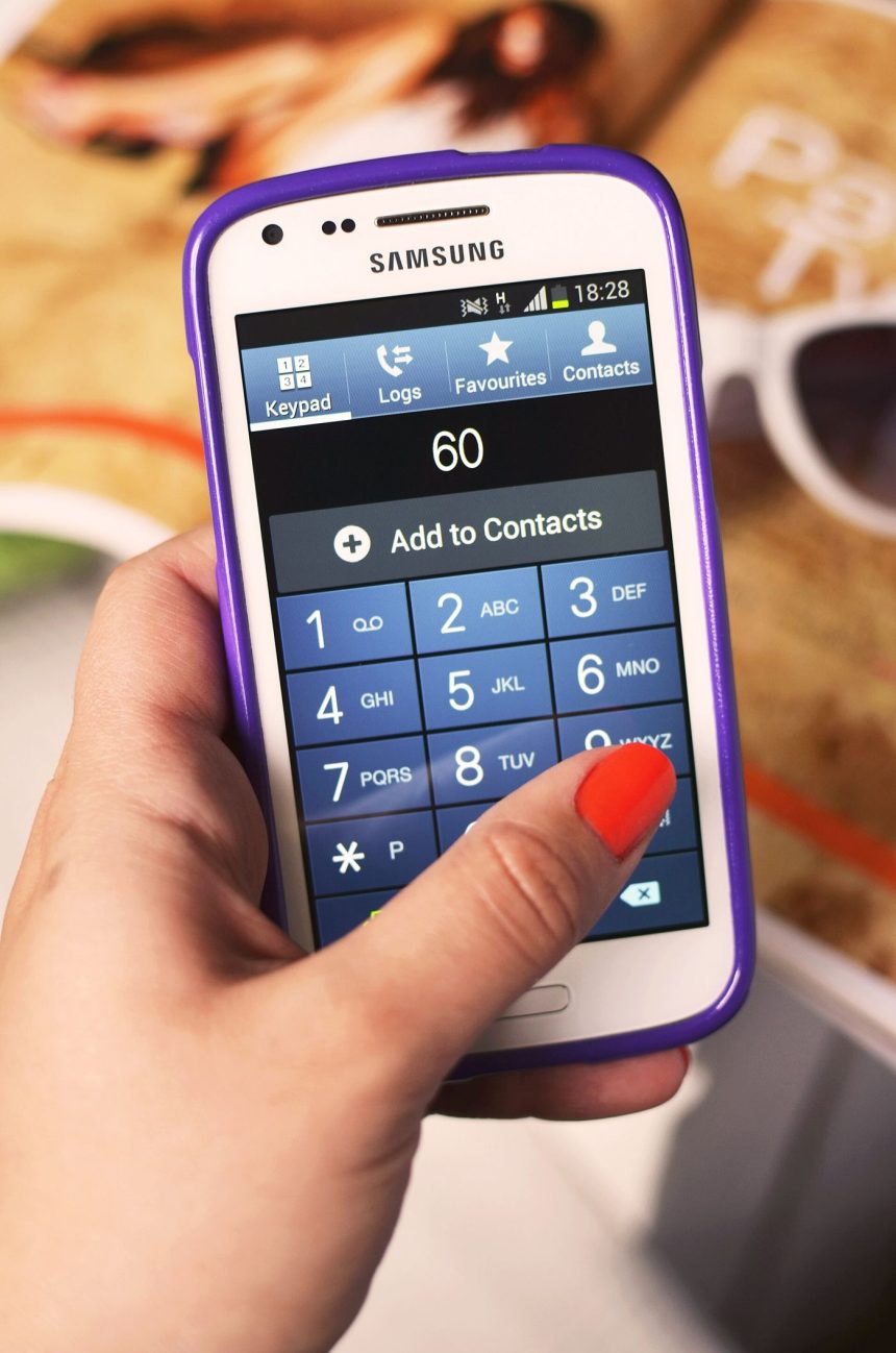 hand holding a smartphone to make a payment