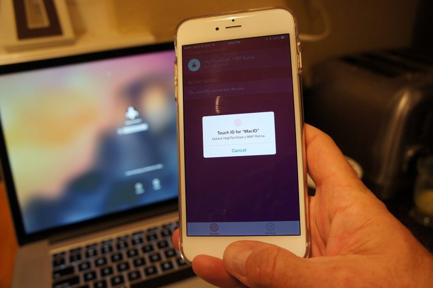 A person unlocking a smartphone with a fingerprint to sign in to an app.